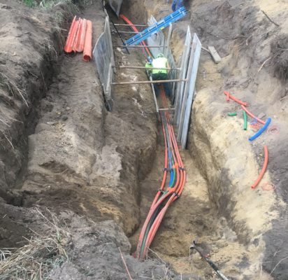 Treton Trench pulling fiber optic cable underground